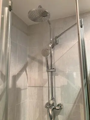 a shower with a shower head in a bathroom at Fantastic apartment in Barberà in Barbera del Valles