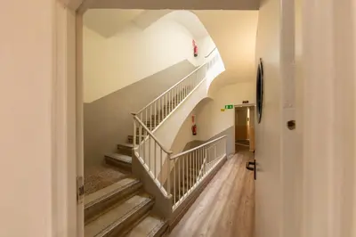 a hallway with stairs in a house at Standbyme Ramblas in Barcelona