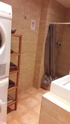 a bathroom with a shower with a sink and a shower at Fasten in Barcelona