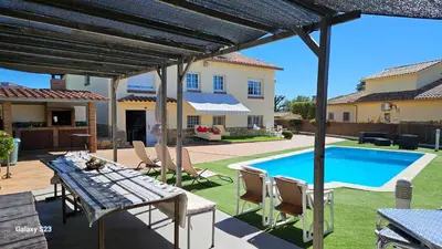 a patio with a table and a swimming pool at Tranquilidad y Privacidad in Cánoves