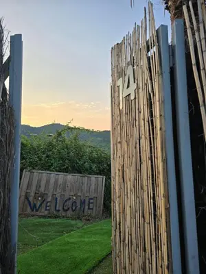 a wooden fence with the number four on it at Can Marisu, Casita privada in Cabrils