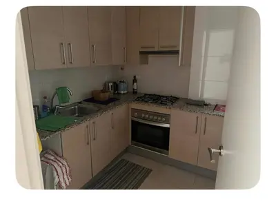 a kitchen with a sink and a stove top oven at Lilli apartment in Sitges