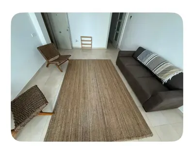 a living room with a couch and a chair at Lilli apartment in Sitges