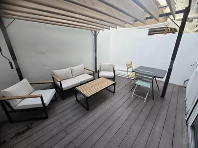 a room with chairs and tables and a table and chairs at Industrial loft in Eixample near Sagrada familia in Barcelona
