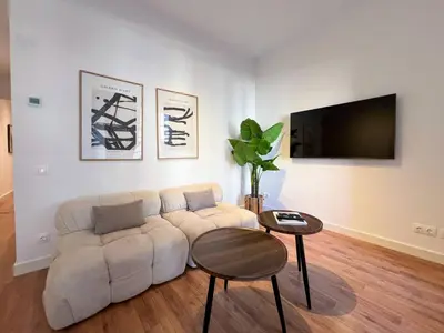 a living room with a couch and a table at Stay U-nique Apartments Balmes III in Barcelona