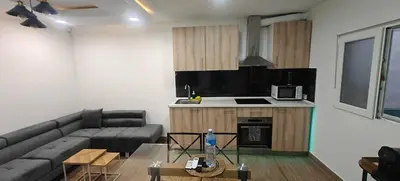 a living room with a couch and a table at Exquisite Flat in Martorell (Barcelona) in Martorell