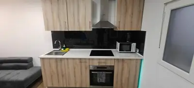 a small kitchen with a sink and a microwave at Exquisite Flat in Martorell (Barcelona) in Martorell