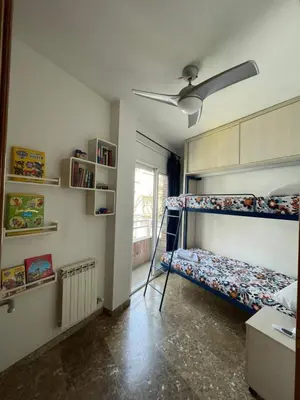a bedroom with two bunk beds and a ceiling at Casa la Luna in Badalona