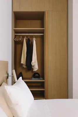 a bedroom with a large bed and a couch at Outsite Barcelona in Barcelona