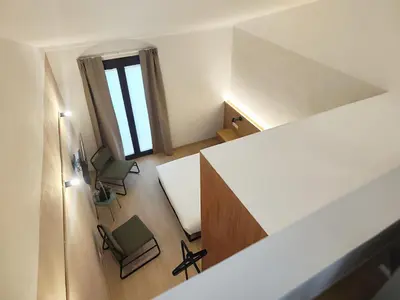 an overhead view of a office with two chairs and a desk at Mazi Plaça Gran in Mataró
