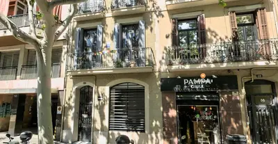 a building with balconies on the side of a street at Bright Industrial Loft Barcelona Center in Barcelona
