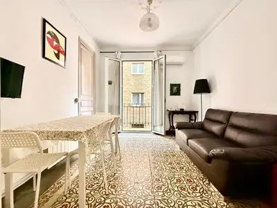 a living room with a couch and a table at Bright 3 Bedroom Apartment Central Barcelona in Barcelona
