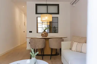 a living room with a table and a couch at Barcelona - Gracia 2-B in Barcelona