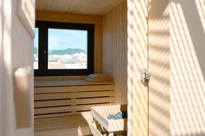 a room with a window and a bench and a table at Barcelona - Gracia 5-B in Barcelona