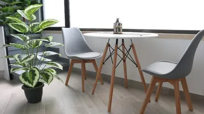 a bedroom with a bed with a black and white comforter at Entire apartment, accessible ground floor in Hospitalet de Llobregat