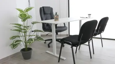 a table with two chairs and a white table and chairs at Entire apartment, accessible ground floor in Hospitalet de Llobregat