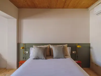 a kitchen with a sink and a stove at Casa Flor Boutique Mid-term Monthly Rentals in Barcelona