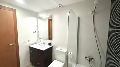 a bathroom with a shower and a toilet and a sink at Luminoso apartamento by Prestigi in Terrassa