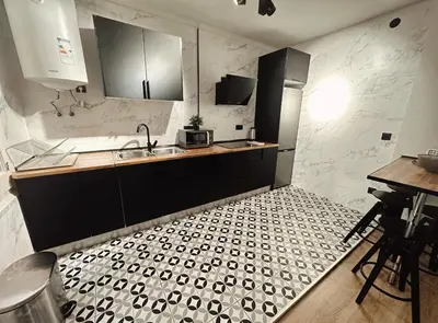 a kitchen with a sink and a counter top at 2 bedrooms apartment in Barcelona F1 in Hospitalet de Llobregat