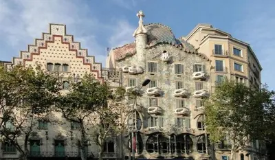 a large building with a cross on top of it at Great apartment with a pool on the beach in Barcelona in Badalona