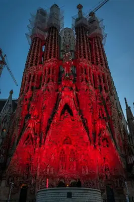 a tall tower with red lights on it at Premium refurbished apartment in Barcelona city center in Barcelona