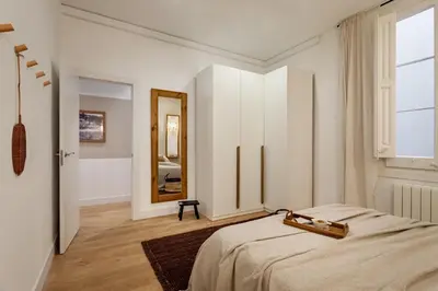 a bedroom with a bed and a ceiling fan at Bingin - 3 bedrooms and balcony in Eixample Dreta in Barcelona
