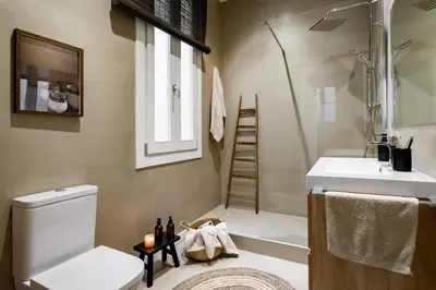 a bedroom with a large bed and a table with a lamp at Bingin - 3 bedrooms and balcony in Eixample Dreta in Barcelona