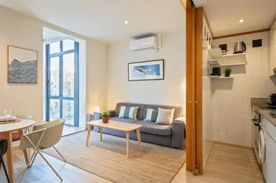 a living room with a couch and a table at Click&Flat Gran Via Barcelona in Barcelona