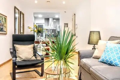 a living room with a couch and a glass table at La Rambla spacious 3BR monthly rental - Parsifal in Barcelona