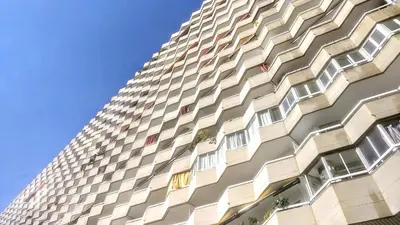 a tall building with lots of windows on it at Gatsby - 3BR Luxury high floor Terrace by Lilla in Barcelona
