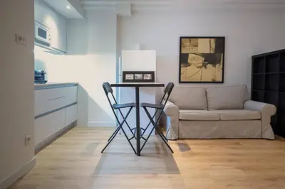 a living room with a table and a couch at Bcn - Loft Parc Guell in Barcelona