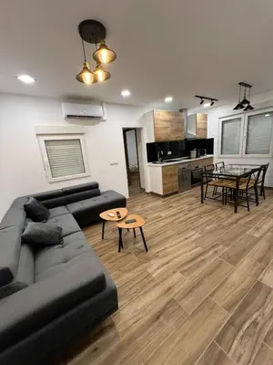 a living room with a couch and a table at Modern apartment 2 Barcelona in Santa Coloma de Gramanet