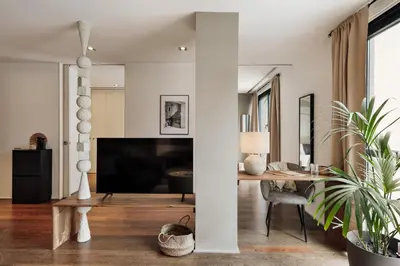 a living room with a table and a couch at Cabuy - 1 bedroom in La Dreta de l'Eixample in Barcelona