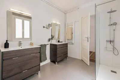 a bedroom with a large bed in a room at Mirra - 5 bedrooms and terrace in Eixample Dreta in Barcelona