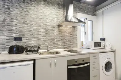 a kitchen with a sink and a microwave at Stay U-nique Apartments Llobregat in Hospitalet de Llobregat
