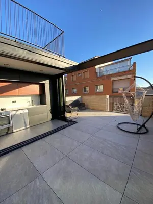 a patio with a basketball hoop on top of a building at Casa Raval Artés in Artés