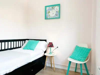 a bedroom with a bed and a chair at Apartment Sunset in Cunit