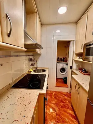 a kitchen with a sink and a stove top oven at Full flat in the heart of Barcelona in Barcelona