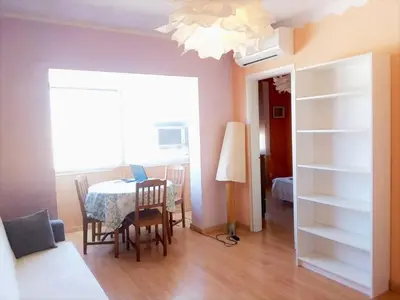 a room with a table and a dining room at 3rooms, 10 minAirport, free parking, public transp in Cornellà de Llobregat