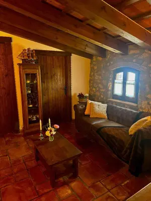 a living room with a couch and a table at Mas del Drac in Castellví de la Marca