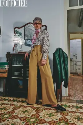 a woman standing in a room wearing a scarf at Vintage home in Barcelona