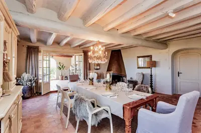 a dining room with a long table and chairs at Montrural in Castellví de la Marca