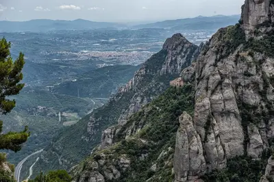 a view of a mountain range with a valley at Cal Sopas in Collbató