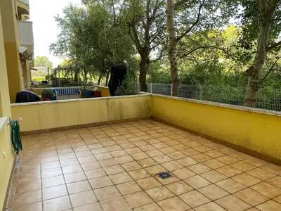 a balcony with a yellow wall and a tile floor at Amazing apartment close to the beach Eli by Hl in Vilanova i la Geltrú