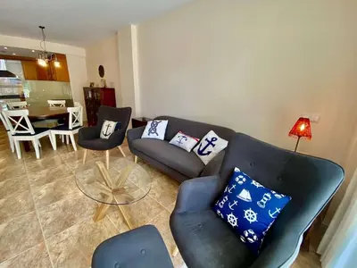 a living room with a couch and chairs and a table at Amazing apartment close to the beach Eli by Hl in Vilanova i la Geltrú