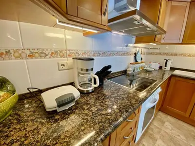 a kitchen with a coffee maker on a counter at Amazing apartment close to the beach Eli by Hl in Vilanova i la Geltrú