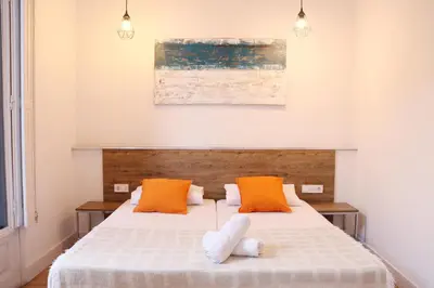two beds sitting next to each other in a room at lullaby by hamilton in Barcelona