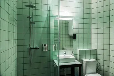 a bathroom with a sink and a shower and a toilet at Brummell Apartments Eixample Derecha/Ballroom in Barcelona