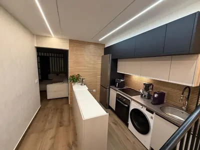 a kitchen with a sink and a washing machine at Beautiful duplex apartment in center Barcelona in Barcelona