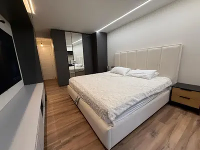 a bedroom with a white bed and a mirror at Beautiful duplex apartment in center Barcelona in Barcelona